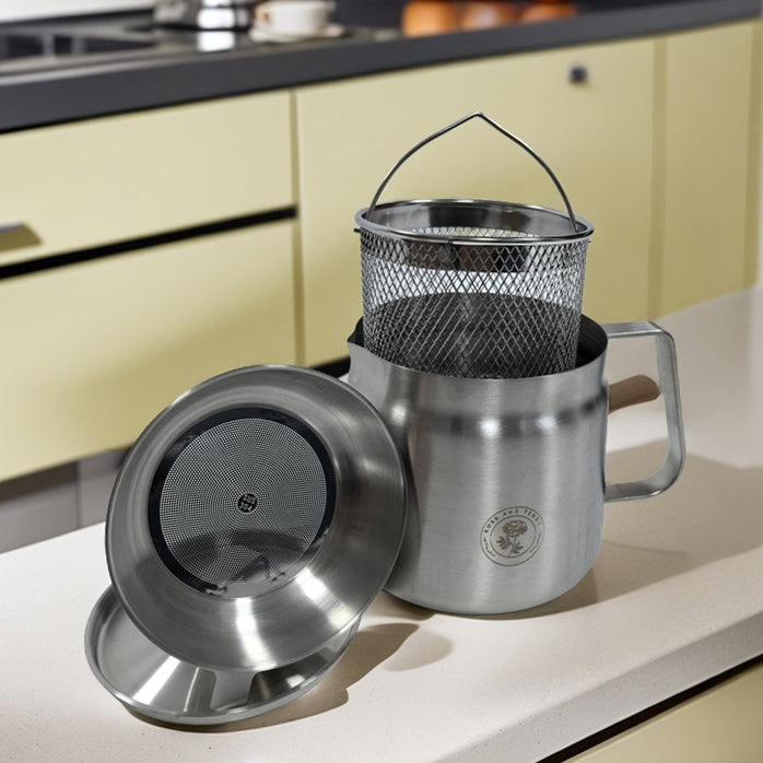 Rose and Stainless Steel Fryer with lid, basket, filter and main fryer on counter top