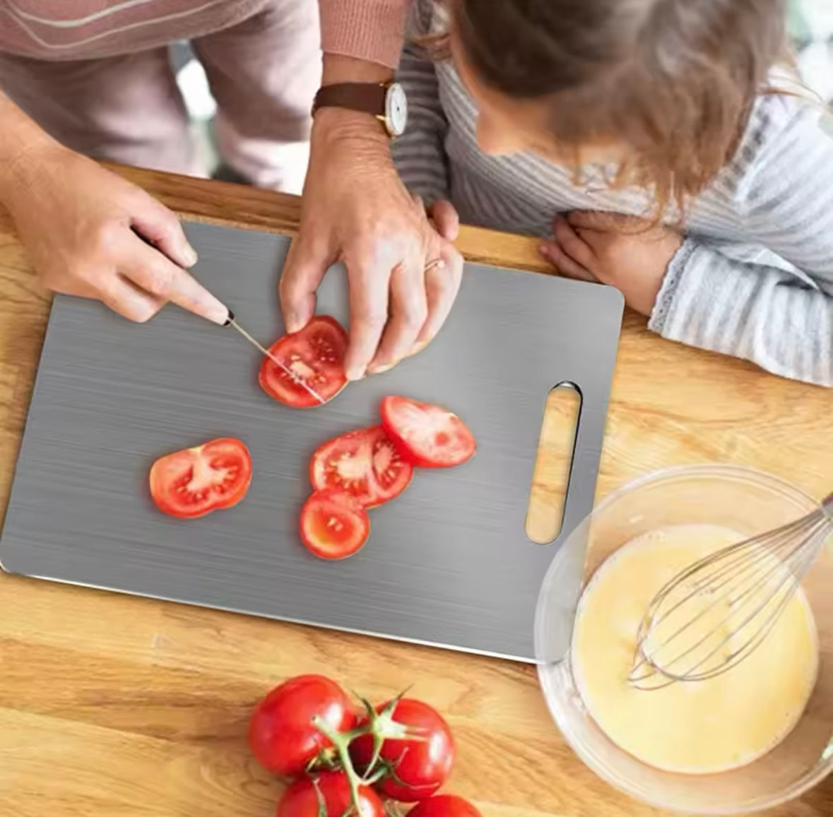 Rose and Teddy Stainless Steel cutting board showing tomatoes being cut