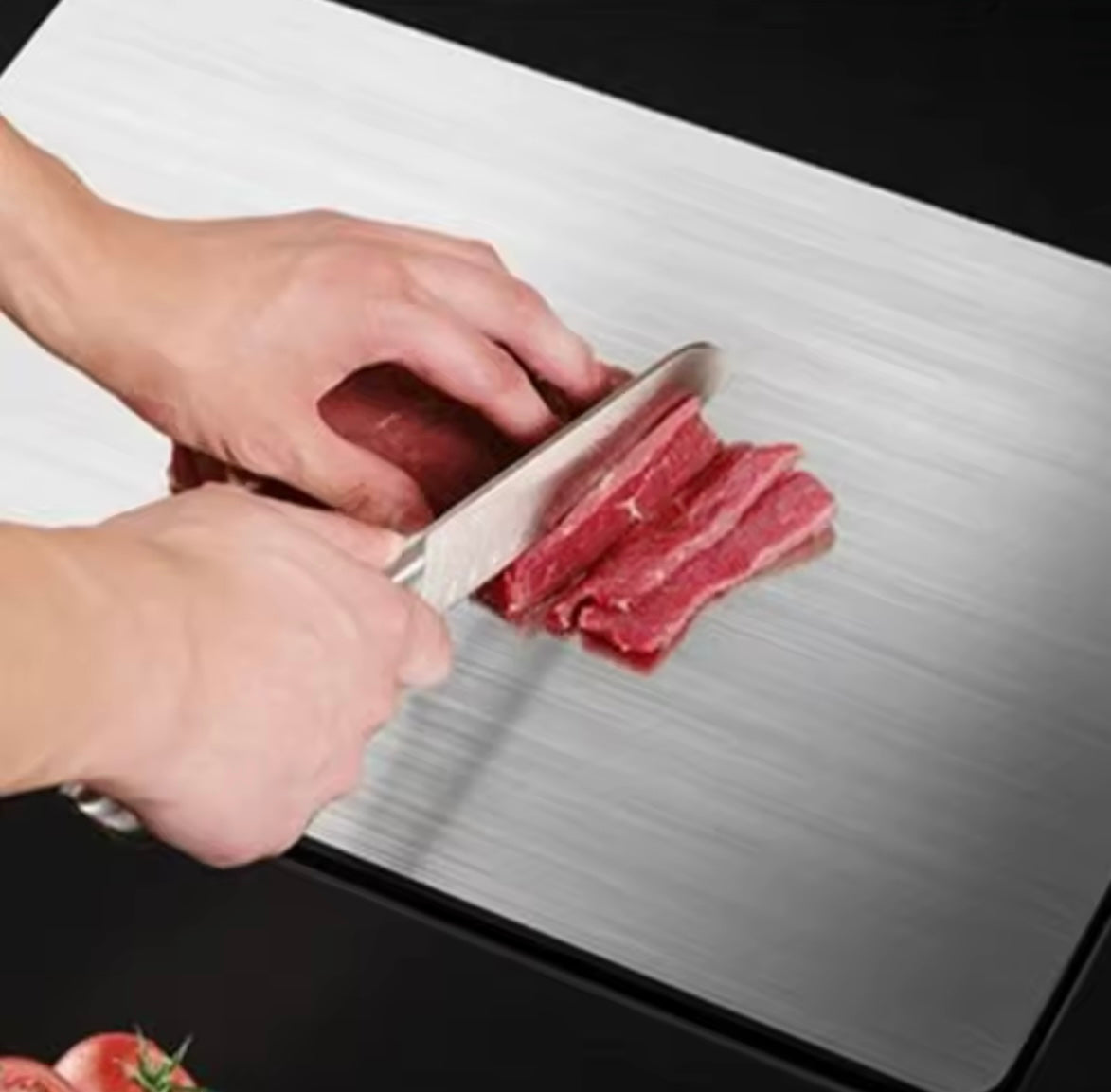 Rose and Teddy Stainless Steel cutting board showing meat being cut