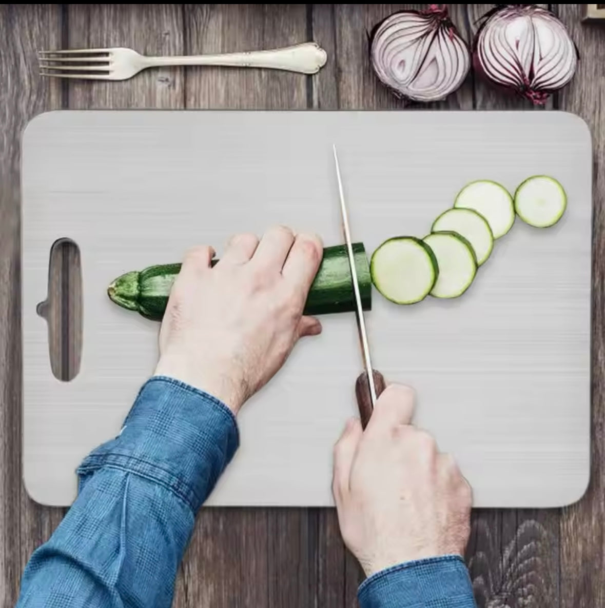 Rose and Teddy Stainless Steel cutting board with women chopping cucumber
